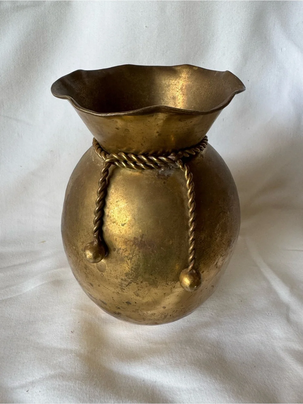 vintage solid brass vase from India featuring a distinctive ruffled rim and a de